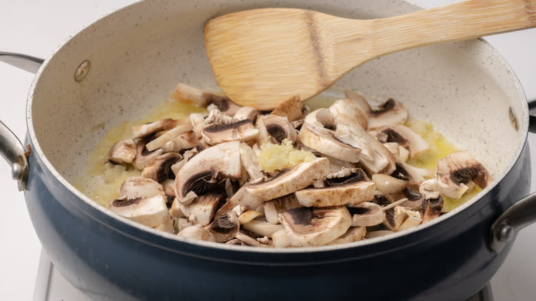 sliced mushrooms in a pan