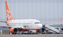 An aircraft transporting passengers from China is seen at an airport outside Kiev