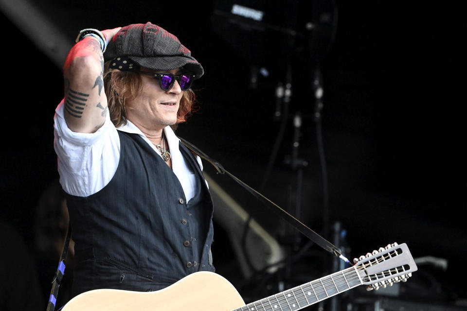 Johnny Depp performs on stage with Jeff Beck during the Helsinki Blues Festival in Helsinki on June, 19, 2022. - Finland OUT (Photo by Jussi Nukari / Lehtikuva / AFP) / Finland OUT (Photo by JUSSI NUKARI/Lehtikuva/AFP via Getty Images)