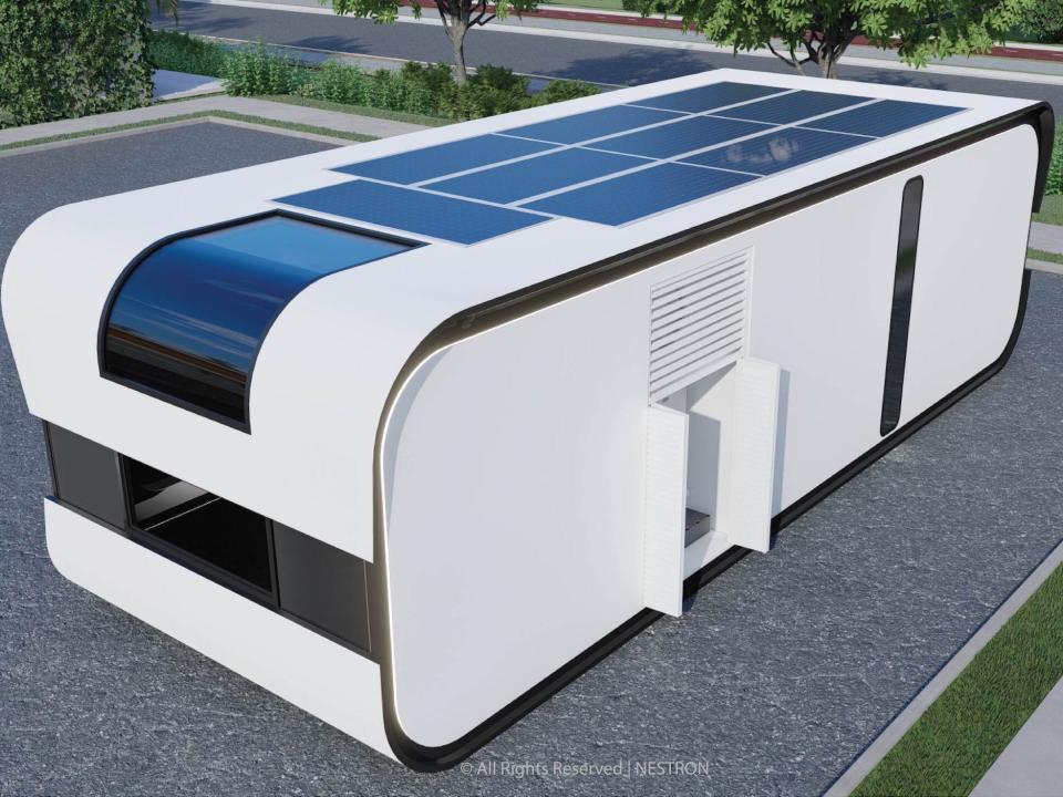 exterior of the one-bedroom Cube Two X with solar panels on the roof