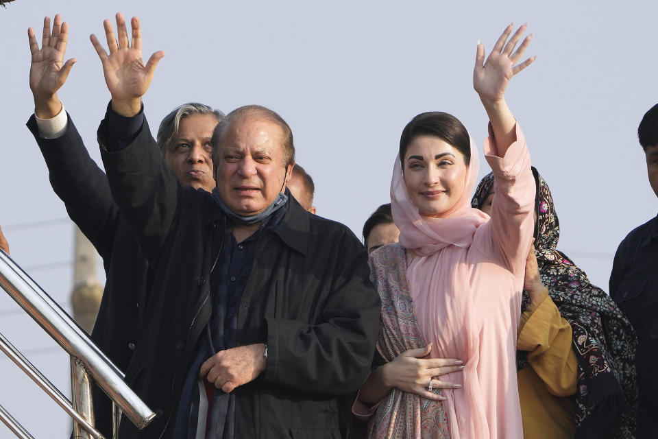 Pakistan's former Prime Minister Nawaz Sharif, center, and his daughter Maryam Nawaz, right, wave to supporters as they arrive to address an election campaign rally in Hafizabad, Pakistan, Thursday, Jan. 18, 2024. (AP Photo/K.M. Chaudary)