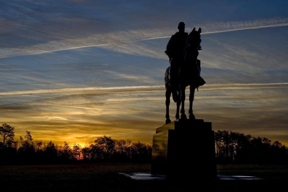 At sunrise the statue of Gen. Thomas J. "Stonewall" Jackson stands over Manassas National Battlefield Park in Virginia. Many cities are hoping to relocate Confederate monuments to parks that put the history of the Civil War into perspective. (Photo: The Washington Post via Getty Images)