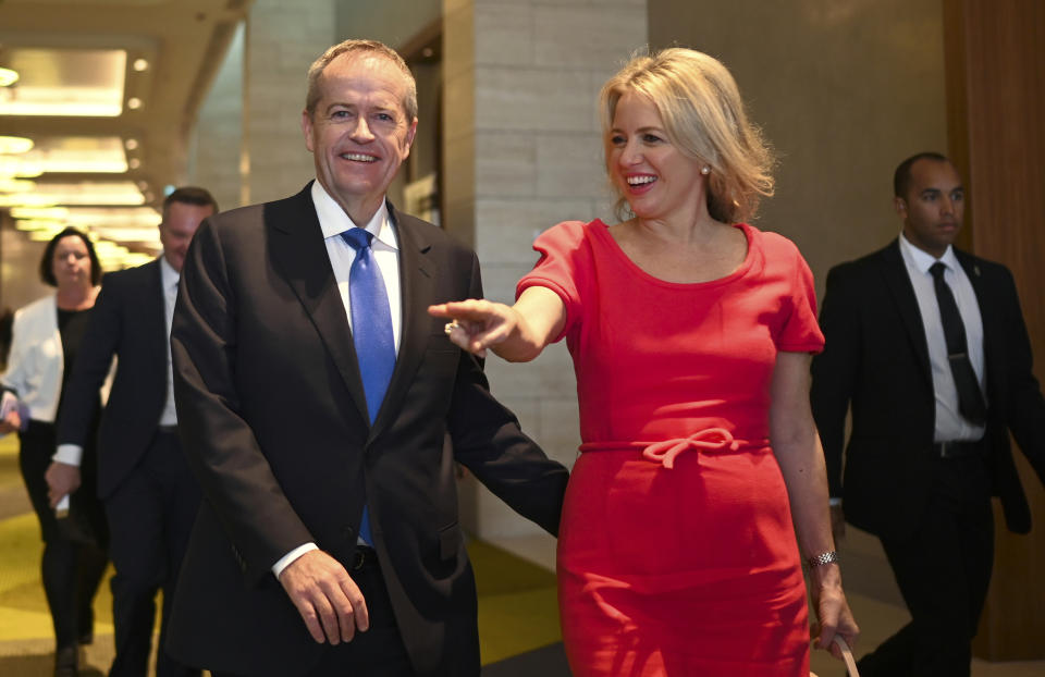 Australian Labour Party leader Bill Shorten, center left, and his wife Chloe Shorten depart the "Leadership Matters" breakfast event in Perth, Australia, Wednesday, May 15, 2019. A federal election will be held in Australia on Saturday, May 18. (Lukas Coch/AAP Image via AP)