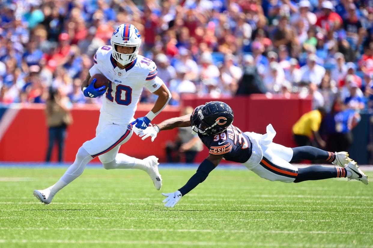 Khalil Shakir of the Buffalo Bills avoids the tackle attempt of Josh Blackwell of the Chicago Bears during the first half of a preseason game at Highmark Stadium on August 10, 2024 in Orchard Park, New York.