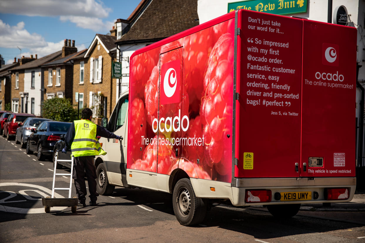 A Ocado delivery driver after dropping off food shopping outside a customer home during the Covid 19 pandemic.