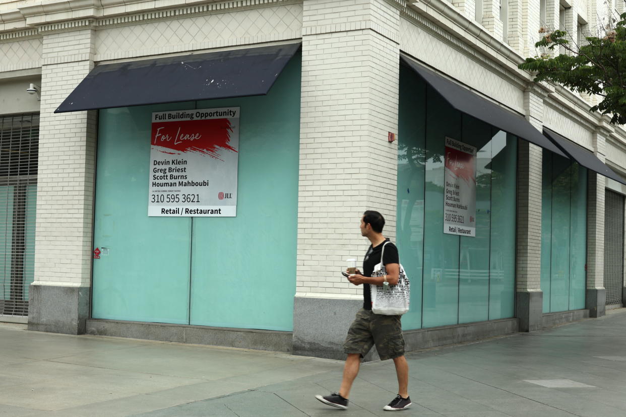 A man looks at an empty commercial real estate retail space in Santa Monica, California, U.S., June 16, 2022. REUTERS/Lucy Nicholson