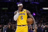 Los Angeles Lakers forward LeBron James wipes his eyes after passing Kareem Abdul-Jabbar to become the NBA's all-time leading scorer during the second half of an NBA basketball game against the Oklahoma City Thunder Tuesday, Feb. 7, 2023, in Los Angeles. (AP Photo/Ashley Landis)