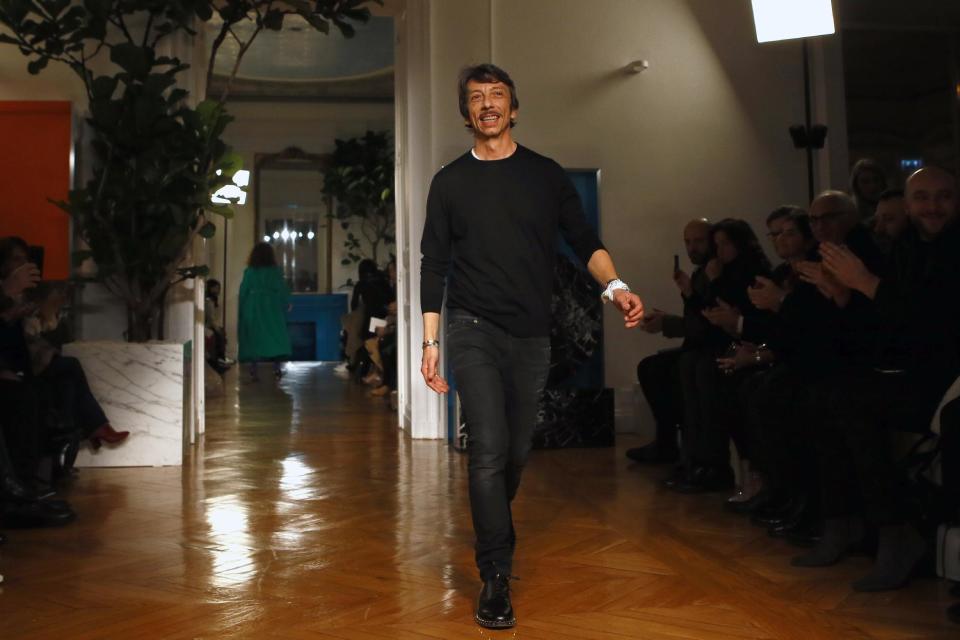 Fashion designer Pierpaolo Piccioli acknowledges applause after Valentino's Fall-Winter 2017/2018 ready-to-wear fashion collection presented Sunday, March 5, 2017 in Paris. (AP Photo/Francois Mori)