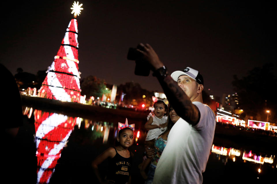 A family takes a sefie during the launch of the Ibirapuera Park Christmas tree in the city of Sao Paulo, Brazil.