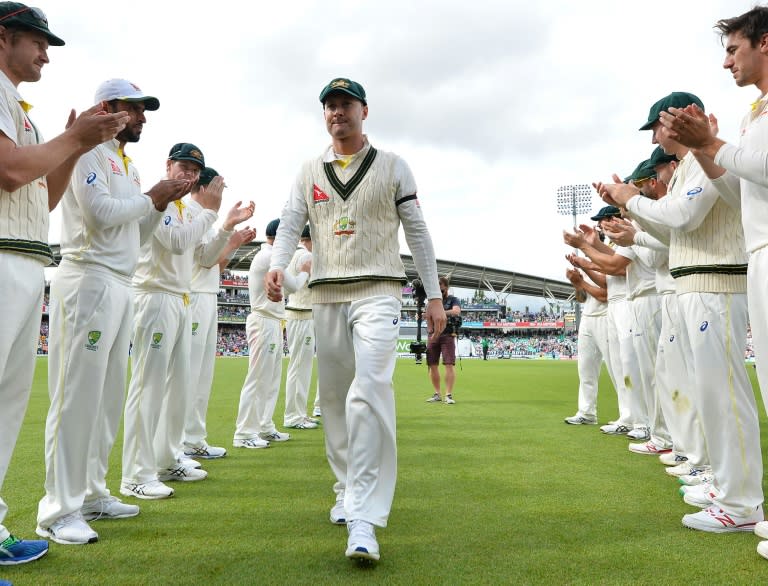 Former Australian captain Michael Clarke receives a guard of honour from his teammates as he leaves the field after Australia wrap up the game on the fourth day of the fifth Ashes Test against England in London on August 23, 2015