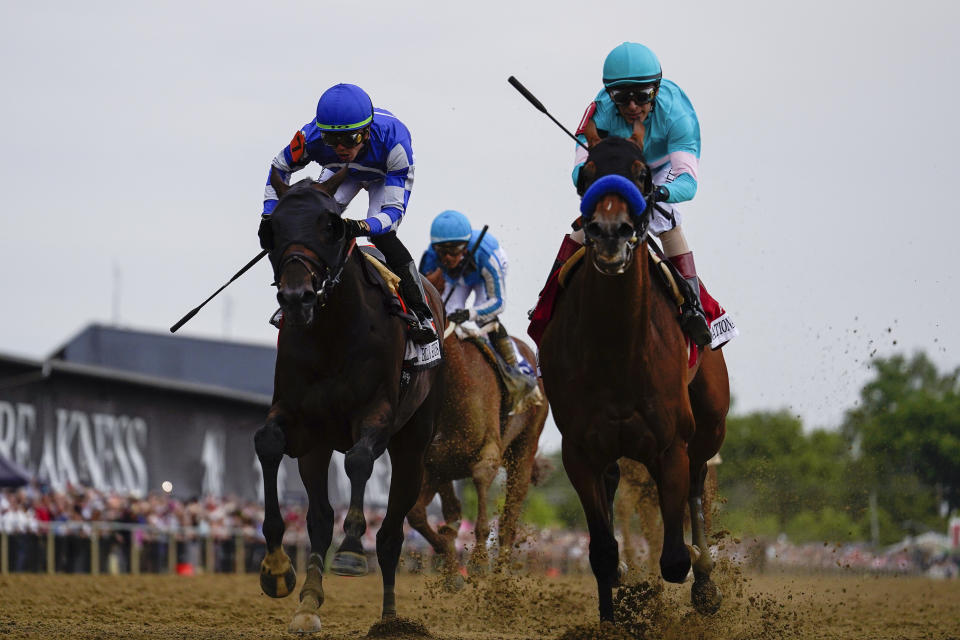 National Treasure, with jockey John Velazquez, right, edges out Blazing Sevens, with jockey Irad Ortiz Jr., to win the148th running of the Preakness Stakes horse race at Pimlico Race Course, Saturday, May 20, 2023, in Baltimore. (AP Photo/Julio Cortez)