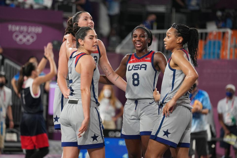 Jackie Young (8) celebrated with her 3-on-3 teammates after they won gold.