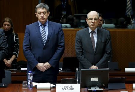 Belgian Interior Minister Jan Jambon and Justice Minister Koen Geens (R) observe a minute of silence to victims of Tuesday's bombings during an extraordinary meeting of European Union interior and justice ministers in Brussels, Belgium, March 24, 2016. REUTERS/Francois Lenoir