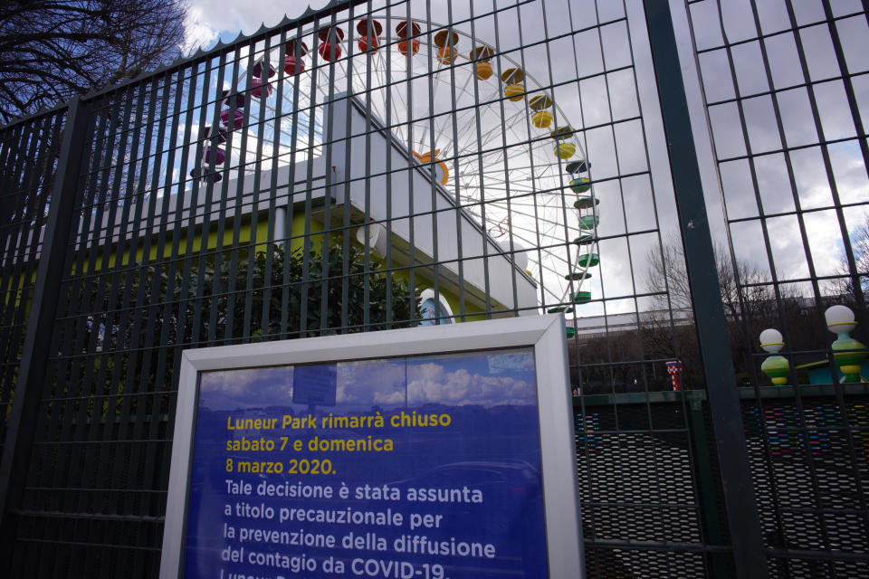 A notice in Italian outside an amusement park in Rome reads 'Luneur Park will be closed on Saturday 7 and Sunday 8 of March, 2020. This decision has been taken to avoid the spread of the COVID-19 contagion', Saturday, Mar. 7, 2020. (AP Photo/Domenico Stinellis)