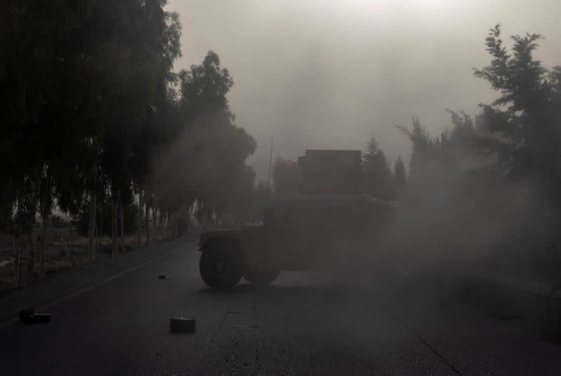 A humvee belonging Afghan Special Forces is seen destroyed during heavy clashes with Taliban during the rescue mission of a police officer besieged at a check post, in Kandahar province