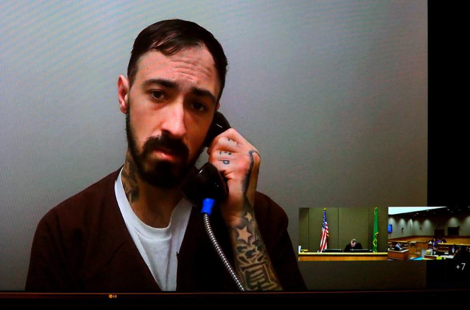 Michael T. Reep, 29, appears Wednesday in Benton County Superior Court via a video link from the Benton County Jail in Kennewick. He is being held in lieu of $1.1 million bail on two counts of illegally possessing a gun, three counts of hit-and-run and driving with a suspended license.