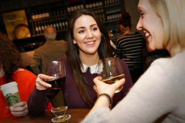 Customers drinking wine at Starbucks