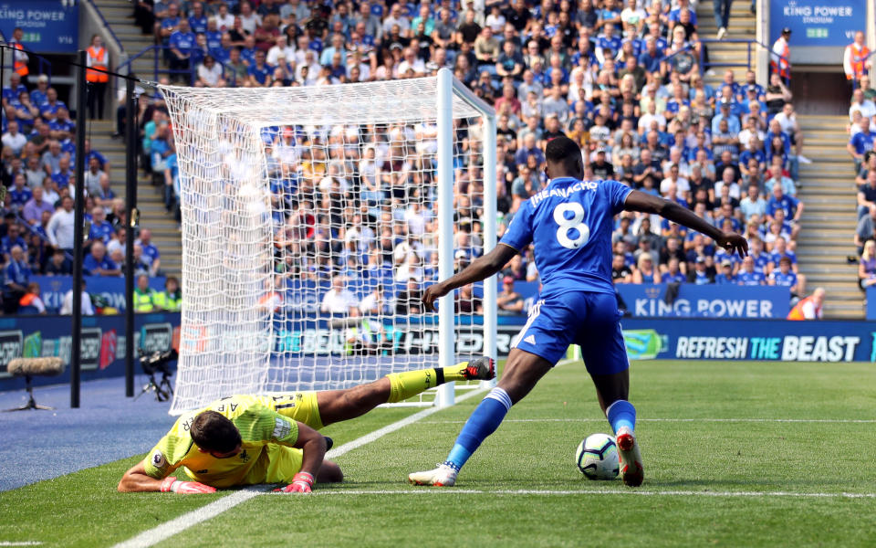 Kelechi Iheanacho wins the ball off Liverpool goalkeeper Alisson in the area leading to Leicester’s goal