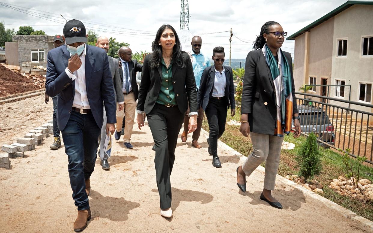 Suella Braverman tours a building site on the outskirts of Kigali during her visit to Rwanda, where migrants deported to the country from the UK could eventually be housed - Stefan Rousseau/PA