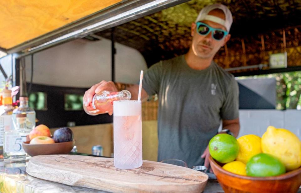 Mike Tedesco makes a non-alcoholic Paloma in Nellie the Mobile Mocktail Bar on Tuesday, Sept. 12, 2023.