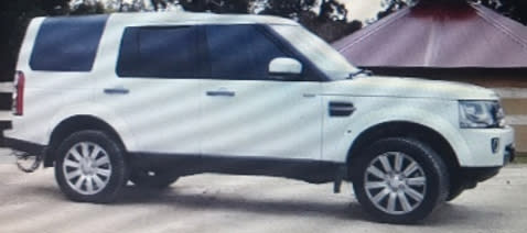 The couple were driving a white 2016 Land Rover Discovery Wagon.