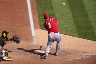 Cincinnati Reds' Asdrubal Cabrera (3) hits a sacrifice fly, driving in a run off Pittsburgh Pirates starting pitcher Cody Ponce, during the seventh inning of a baseball game in Pittsburgh, Thursday, Sept. 16, 2021. (AP Photo/Gene J. Puskar)