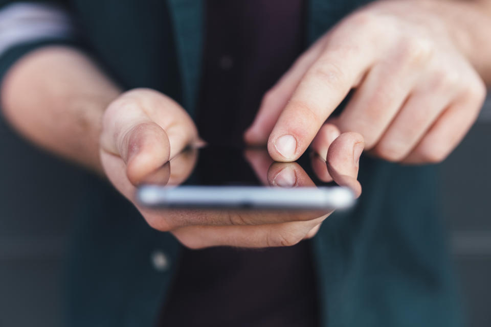 hands holding a phone