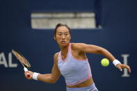 Qinwen Zheng, of China, returns the ball to Rebecca Marino, of Canada, during the National Bank Open tennis tournament in Toronto, on Tuesday, Aug. 9, 2022. (Christopher Katsarov/The Canadian Press via AP)