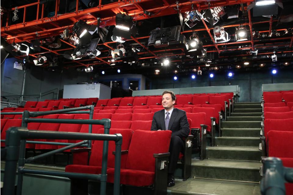 This Monday, Oct. 29, 2012 photo released by NBC shows host Jimmy Fallon sitting in an empty studio where his show "Late Night with Jimmy Fallon," is taped in New York. The audience was absent due to inclement weather caused by superstorm Sandy. (AP Photo/NBC, Lloyd Bishop)