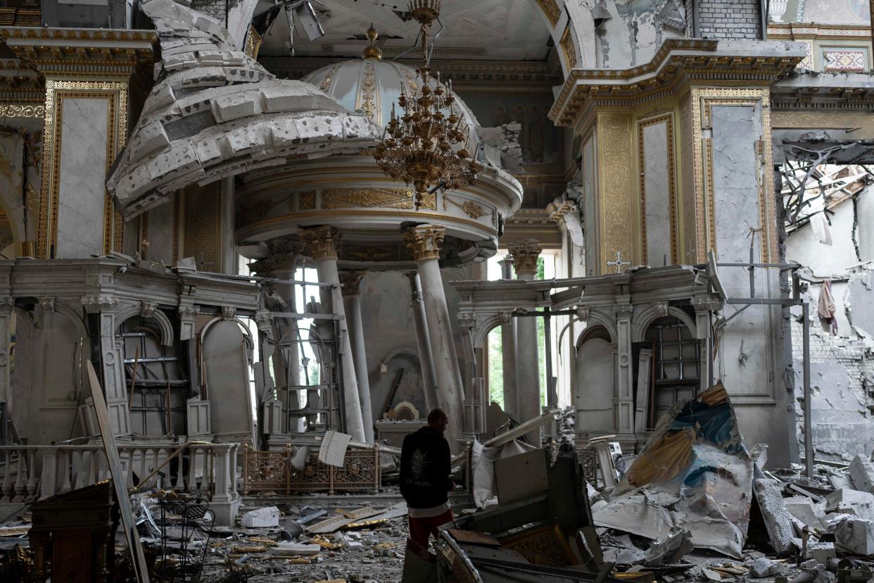 A church personnel inspects damages inside the Odesa Transfiguration Cathedral in Odesa (AP)