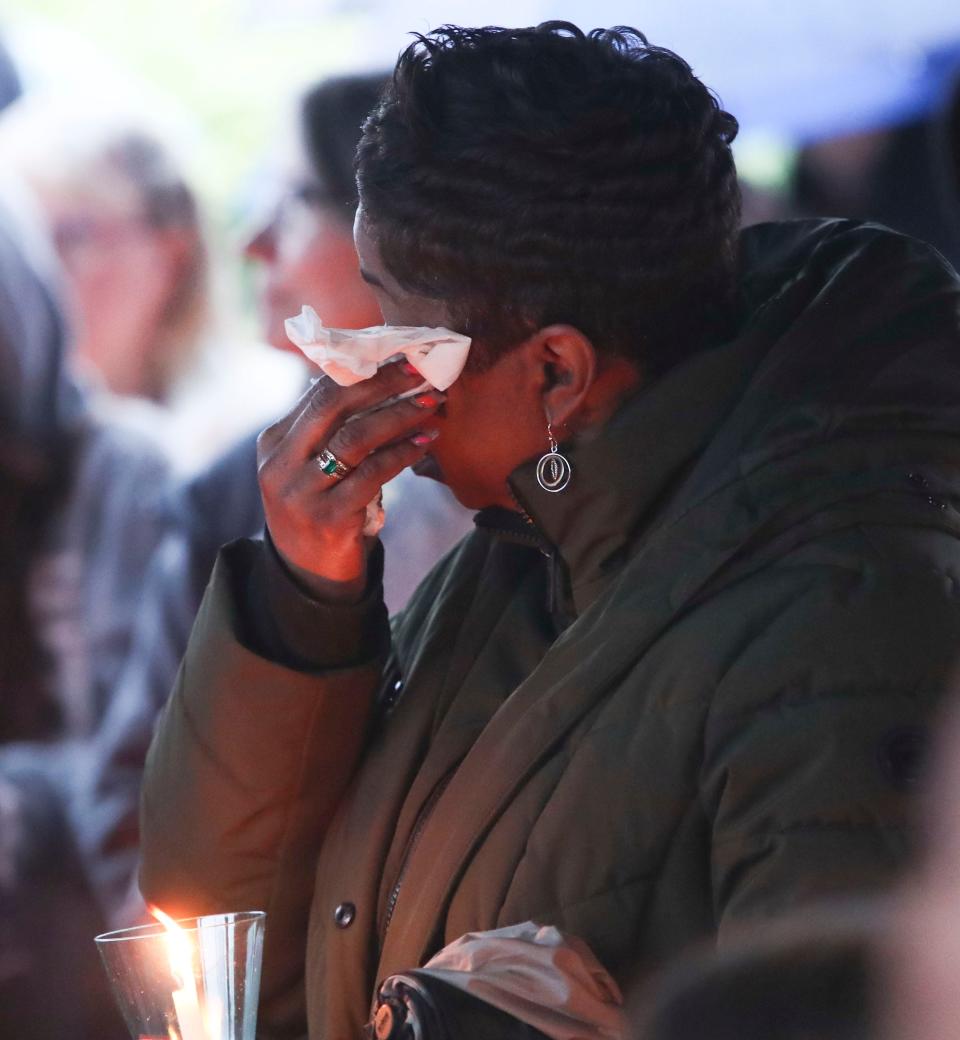 A mourner wipes away a tear during a candlelight vigil in memory of Marbrook Elementary School student James Raul Messick, Friday, May 10, 2024. Messick, who was a month shy of his 11th birthday, died when he was struck on his walk home from school by a vehicle that left the roadway.