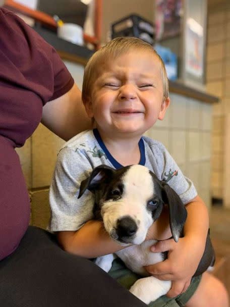 PHOTO: Bentley Boyers, 2, is seen holding his newly adopted rescue puppy, Lacey, on Sept. 4, 2020 at Jackson County Animal Shelter in Jackson County, Michigan. Both Bentley and Lacey were born with a cleft lip. (Lydia Sattler/Jackson County Animal Shelter)