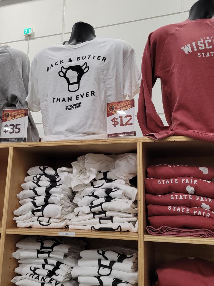 A &quot;Back &amp; Butter Than Ever&quot; T-shirt is one of the official State Fair merchandise items for sale in the expo hall at Wisconsin State Fair.