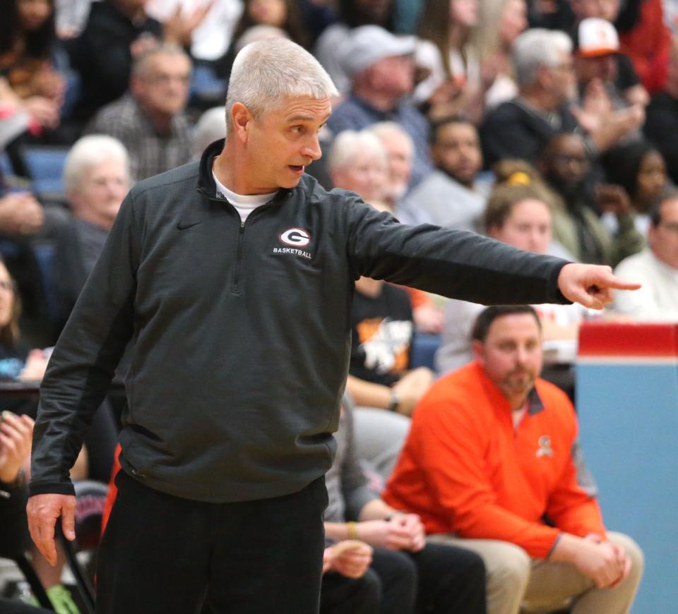 Green boys basketball coach Mark Kinsley instructs his team vs. Stow in a Division I district final at Alliance on Saturday, March 5, 2022.