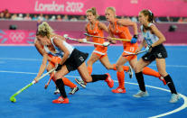 LONDON, ENGLAND - AUGUST 10: Delfina Merino #12 of Argentina controls the ball against the Netherlands during the first half of the Women's Hockey gold medal match on Day 14 of the London 2012 Olympic Games at Hockey Centre on August 10, 2012 in London, England. (Photo by Mike Hewitt/Getty Images)