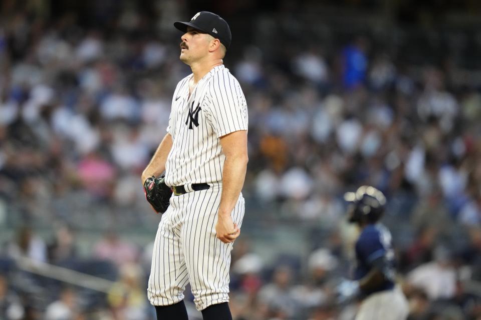 New York Yankees starting pitcher Carlos Rodon reacts as Tampa Bay Rays' Randy Arozarena runs the bases after hitting a two-run home run during the third inning of a baseball game Tuesday, Aug. 1, 2023, in New York. (AP Photo/Frank Franklin II)