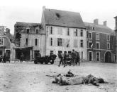 The body of a dead German soldier lies in the main square after the town was taken by U.S. troops who landed at nearby Omaha Beach in Trévières, France, on June 15, 1944. (Photo: U.S. National Archives/handout via Reuters)