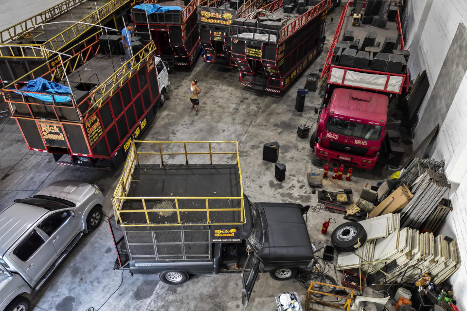 Sound trucks popularly referred to as electric trios sit parked in the Rick Sound company warehouse, in Rio de Janeiro, Brazil, Tuesday, Jan. 30, 2024. The behemoth sound trucks are a fixture of Brazil's Carnival festivities and draw millions to the streets. (AP Photo/Bruna Prado)