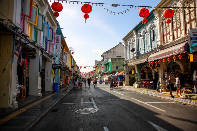 Tourists are seen at a walking street in Phuket