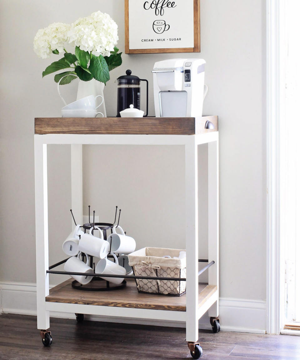 <p> &apos;I wanted to make a DIY bar cart that really looked like a custom, higher-end bar cart and that was also a bit rustic.&apos; says Angela Marie, founder of Angela Marie made blog. </p> <p> &apos;This DIY bar cart was a little more time-consuming to build, but definitely worth it in the end, especially for the amount of savings! It cost me&#xA0;<em>less than $50</em>&#xA0;in building materials to build, whereas other similar bar carts retail around $150+. Note, I did have the paint and stain on hand already for the finishing, so that is not included in the material cost.&apos;&#xA0; </p> <p> <strong>You will need:&#xA0;</strong> </p> <p> (3) 2&#xD7;2 @ 8ft furring strips </p> <p> (1) 1&#xD7;2 @ 8ft </p> <p> (1) 1&#xD7;4 @ 8ft </p> <p> (1) 1&#xD7;3 @ 8ft </p> <p> (1) 2ft x 2ft @ 3/4&#x2033; thick pine plywood </p> <p> (4) 2&#x2033; Casters </p> <p> (2) 3/8&#x2033; round wood dowel rods @ 4ft </p> <p> 2 1/2&#x2033; and 1 1/4&#x2033; <a href="https://www.amazon.com/s?k=kreg+screws" rel="nofollow noopener" target="_blank" data-ylk="slk:Kreg screws;elm:context_link;itc:0" class="link ">Kreg screws</a> </p> <p> 1 1/4&#x2033; Brad nails </p> <p> <a href="https://www.amazon.com/Gorilla-Ultimate-Waterproof-1-Pack-Natural/dp/B08J1LCDHT" rel="nofollow noopener" target="_blank" data-ylk="slk:Wood glue;elm:context_link;itc:0" class="link ">Wood glue</a> (Go for Gorilla Ultimate) </p> <p> 2&#x2033; Wood screws </p> <p> (2) Cabinet pulls </p> <p> <a href="https://www.amazon.com/Kreg-K4MS-Jig-Master-System/dp/B0044BBOQK" rel="nofollow noopener" target="_blank" data-ylk="slk:Kreg K4MS Jig Master System;elm:context_link;itc:0" class="link ">Kreg K4MS Jig Master System</a> </p> <p> <a href="https://www.amazon.com/s?k=drill" rel="nofollow noopener" target="_blank" data-ylk="slk:Drill;elm:context_link;itc:0" class="link ">Drill </a>(Find loads on Amazon!) </p> <p> <a href="https://www.amazon.com/DEWALT-12-Inch-15-Amp-Compound-DWS715/dp/B07P8QTFRC" rel="nofollow noopener" target="_blank" data-ylk="slk:Miter saw;elm:context_link;itc:0" class="link ">Miter saw</a> (This DeWalt machine is Amazon&apos;s bestseller) </p> <p> <a href="https://www.amazon.com/5280-01-15-Amp-4-Inch-Circular-Single/dp/B01BD81BLO" rel="nofollow noopener" target="_blank" data-ylk="slk:Circular Saw;elm:context_link;itc:0" class="link ">Circular Saw</a> (This SKIL-branded saw is one of Amazon&apos;s top picks) </p> <p> <a href="https://www.amazon.com/dp/B001DSY4QO" rel="nofollow noopener" target="_blank" data-ylk="slk:Clamps;elm:context_link;itc:0" class="link ">Clamps</a> (Secure these IRWIN QUICK-GRIP Clamps on Amazon) </p> <p> <a href="https://www.amazon.com/s?k=cordless+brad+nailer" rel="nofollow noopener" target="_blank" data-ylk="slk:Brad nailer;elm:context_link;itc:0" class="link ">Brad nailer</a> (Choose from a selection of cordless types) </p> <p> <a href="https://www.amazon.com/dp/B0049XUN74" rel="nofollow noopener" target="_blank" data-ylk="slk:Rust-Oleum spray paint in rubbed bronze;elm:context_link;itc:0" class="link ">Rust-Oleum spray paint in rubbed bronze</a> (Get it from Amazon) </p> <p> <a href="https://www.amazon.com/Minwax-22716-Finish-Interior-Walnut/dp/B000PR5EB8" rel="nofollow noopener" target="_blank" data-ylk="slk:Minwax wood finish interior wood stain in dark walnut;elm:context_link;itc:0" class="link ">Minwax wood finish interior wood stain in dark walnut </a>(Grab it from Amazon) </p> <p> <a href="https://www.anniesloan.com/us/product/waxes-and-finishes/white-chalk-paint-wax/" rel="nofollow noopener" target="_blank" data-ylk="slk:Annie Sloan white chalk paint wax;elm:context_link;itc:0" class="link ">Annie Sloan white chalk paint wax</a>&#xA0; </p> <p> <strong>How to:&#xA0;</strong> </p> <p> <strong>Make your bar cart frame cuts from the 2x2s: </strong>Angela used 2&#xD7;2 furring strips for the frame of my bar cart. This saved her a ton of money, but she advises that try to choose really straight 2x2s and make sure you sand them really well since they are a more rough grade of wood. &#xA0;You&apos;ll need to cut 4 pieces at 30.5&#x2033;, &#xA0;4 pieces at 22.5&#x2033;, and 4 pieces at 14&#x2033;. </p> <p> <strong>Drill pocket holes and attach frame pieces: </strong>Layout how your frame is going to go together. Use two of the 30.5&#x2033; 2&#xD7;2 pieces for your sides and two of the 22.5&#x2033; 2&#xD7;2 pieces for the top and bottom of the frame. Angela placed my bottom frame piece 3&#x2033; up from the bottom of the side pieces since this is what the bottom shelf of the bar cart will sit on. Mark where your pocket holes need to go, one on each end of the two 22.5&#x2033; pieces (make sure you do them on the bottom side of your 2x2s so they don&#x2019;t show). Then, drill your pocket holes with a Kreg Jig. Use 2 1/2&#x2033; Kreg screws to attach the frame together. Repeat these same steps for the other side of the frame. Angela used a scrap piece of 2&#xD7;2 to help keep the pieces even as we drilled them together. </p> <p> <strong>Finish assembling the DIY bar cart frame: </strong>Drill one pocket hole on each end of your four 14&#x2033; 2&#xD7;2 pieces. Add two of your 14&#x2033; 2&#xD7;2 pieces to the bottom of one frame side and to the top of the other frame side using pocket holes and 2 1/2&#x2033; Kreg screws. The pocket holes can be either on the inside or underneath part of the 2x2s as you attach them, either way, they won&#x2019;t show. Now attach your two frame pieces to form the final bar cart frame. Note, when attaching the frame on the short 14&#x2033; sides, the long Kreg drill bit to drive screws into the pocket holes, is too long with a standard drill. Angela had a smaller square tip drill bit that Angela used instead for this part. </p> <p> <strong>Make the bottom shelf of the DIY wood bar cart: </strong>Cut your 1&#xD7;4 into four 24&#x2033; pieces. The cuts don&#x2019;t have to be perfect for this step. Then, line up your 1&#xD7;4 pieces and drill pocket holes as shown in the photo below and attach with 1 1/4&#x2033; Kreg screws. To get a perfectly straight edge on each side, use a circular saw and trim each side so that the final length of your shelf is 22.5&#x2033; (the width should be 14&#x2033; already from your attached four 1x4s). Next, cut two 1&#xD7;2 pieces at 22.5&#x2033; and two at 14&#x2033;. These pieces are going to be attached to the sides of your shelf piece as shown in the photos below. But, before you attach them to the shelf, make sure they fit snugly between the frame sides, you may need to sand them down slightly to get a better fit (Angela had to do this for two of them). Add two pocket holes to the bottom shelf sides as shown in the below photo and attach 1&#xD7;2 pieces with 1 1/4&#x2033; Kreg screws. Flip over and your bottom shelf should like the 2nd photo below! Go ahead and place the bottom shelf on the lower frame and make sure it fits well but don&#x2019;t attach it yet to the frame. </p> <p> <strong>Make the top tray shelf of the bar cart: </strong>Using a circular saw, cut one side of your 2ft x 2ft plywood piece to 15.5&#x2033; so that the final size is 24&#x2033; x 15.5&#x2033;. Next, for joining the sides of the top tray shelf, you can either do straight cuts or 45 degree angled cuts. I chose to do the angled cuts to make the bar cart look a bit higher end even though angled cuts are a bit more challenging. Either way, cut two 1&#xD7;3 pieces at 25.5&#x2033;. Attach the two 25.5&#x2033; pieces to each long side of the plywood using a brad nailer and 1 1/4&#x2033; brad nails. If you did angled cuts, make sure the inner angles on the ends are lined up correctly to the plywood edges before nailing. Now measure the exact width for your two side pieces. It should be just about 17&#x2033; but mine was off by 1/16&#x2033; so I adjusted my cuts accordingly. It&#x2019;s always good to measure twice and cut once! Then, attach your two side pieces with brad nails to complete the top shelf tray of the bar cart! Also, for these side pieces, Angela put brad nails along the bottom edge and side edges to make it more secure. </p> <p> <strong>Prepare dowel rods: </strong>Cut the 3/8&#x2033; dowel rods as follows: two pieces at 23.5&#x2033; and two at 14.5&#x2033;. Then, mark the center point on the inside edge of the 2&#xD7;2, 4&#x2033; up from the bottom shelf (on all inside edges for a total of 8 marks). Use a 1/2&#x2033; drill bit and drill 8 holes where your markings are. Note, Angela first drilled a 1&#x2033; deep hole and then 1/2&#x2033; deep on the opposite side and continued this pattern until she finished all 8 holes. She marked 1&#x2033; and 1/2&#x2033; on a scrap dowel piece to test my depths for each hole to make sure I drilled deep enough. Go ahead and add your dowel rods to the holes to make sure they fit properly. It works best to put them into the 1&#x2033; deep side holes first to get them in. If you are having trouble getting them in, trim off 1/4&#x2033; or so more but be careful not to trim too much off. </p> <p> <strong>Paint bar cart frame and fill holes: </strong>If you&#x2019;d like to have a cleaner look use wood filler to fill holes on the top tray shelf over the brad nail holes. Angela also used light spackle to fill any wood knots/cracks in the frame that is getting painted. If you are staining the frame, use wood filler. Sand where needed to prep the frame for painting (or staining). Then, paint (or stain) the frame. Angela chose to do a white frame for the bar cart. </p> <p> <strong>Attach caster wheels to bar cart frame: </strong>Angela bought her 2&#x2033; casters at Lowes. They come two to a pack and each caster has a spiky metal piece that you need to remove from the caster. Flip over your bar cart frame and drill a 1/2&#x2033; hole in the middle of the bar cart leg bottoms. Make sure to drill the hole a little bit deeper than the length of the spiky metal piece. Then tap the spiky metal piece into the hole with a hammer until the spiky part goes into the wood. Next, place your caster wheel into the metal hole and it should click into place. Repeat for all sides. </p> <p> <strong>Stain and finish the top tray shelf and bottom shelf of your bar cart and attach to the bar cart frame: </strong>Stain your top tray shelf and bottom shelf. Angela used one coat of Minwax Dark Walnut and then applied one coat of Annie Sloan White Wax, but finish however you&#x2019;d prefer!&#xA0; </p> <p> <strong>Spray paint your round, dowel rods:</strong> Angela used Rust-Oleum Oil Rubbed Bronze. </p> <p> <strong>Secure your dowel rods:</strong> Add a little bit of wood glue to the dowel rod ends and attach them as well to your bar cart. </p> <p> <strong>Attach top tray shelf to DIY bar cart: </strong>Attach your top tray shelf to your bar cart with 2&#x2033; wood screws from the bottom side. It&#x2019;s best to drill pilot holes first about 3/4&#x2033; from the inside of the bar cart (so it goes through the frame and plywood piece of the tray, not the side 1&#xD7;3 edges). Also, clamp the tray down while drilling. Lastly, add cabinet pulls on each side of your top tray shelf. </p>