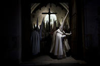 <p>Penitents of the Jesús Yacente brotherhood take part in a Holy Week procession in Zamora, Spain, March 28, 2013. (Photo: Daniel Ochoa de Olza/AP) </p>