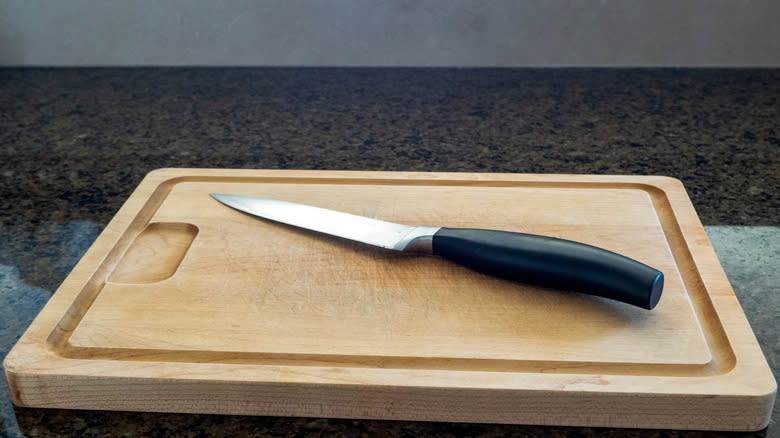 paring knife on a cutting board