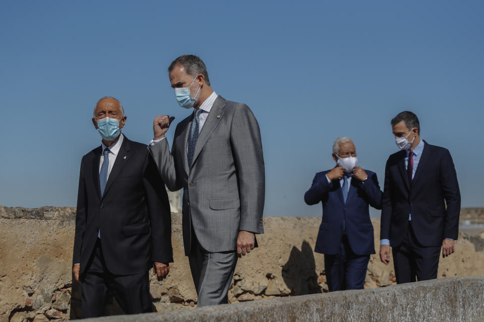 From left to right: Portugal's President Marcelo Rebelo de Sousa, Spain's King Felipe VI, Portugal's Prime Minister Antonio Costa and Spain's Prime Minister Pedro Sanchez during a ceremony to mark the reopening of the Portugal/Spain border in Badajoz, Spain, Wednesday, July 1, 2020. The border was closed for three and a half months due to the coronavirus pandemic. (AP Photo/Armando Franca)