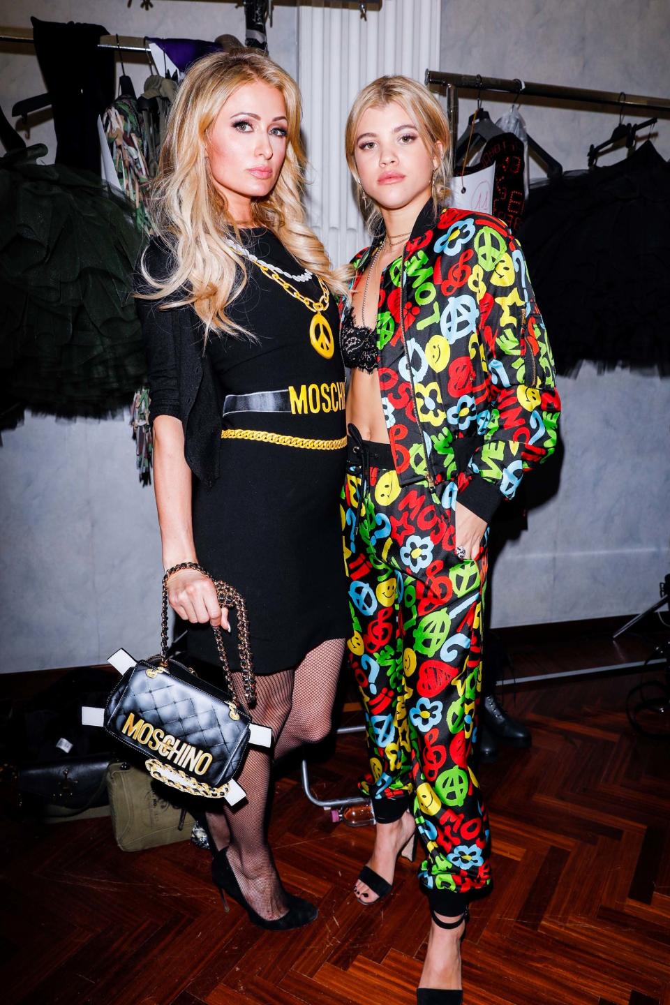 In designer Jeremy Scott’s hyper-colored Moschino world, his high-wattage front row regulars prove that over-the-top is just right.