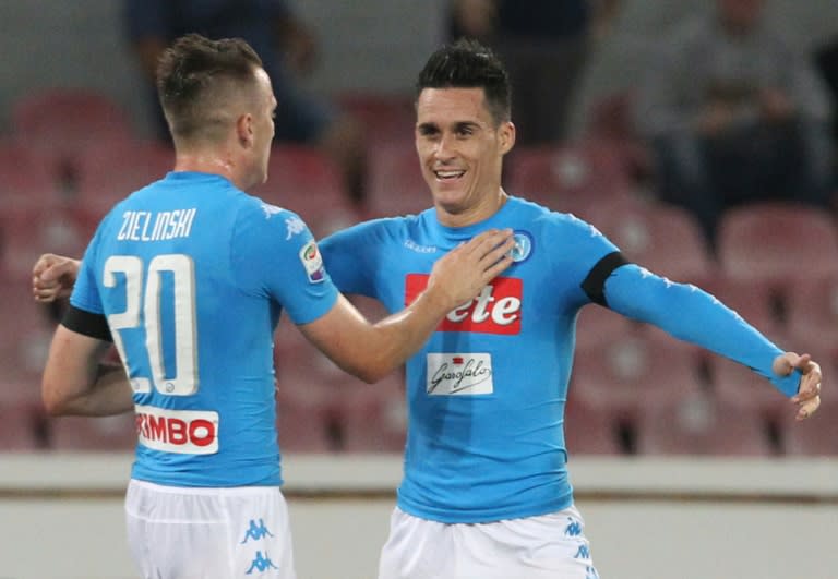 Napoli's Jose Maria Callejon (R) celebrates after scoring in a match against Bologna FC on September 17, 2016