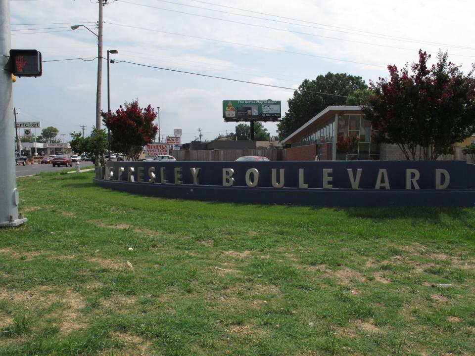 A newly-built sign marking Elvis Presley Blvd. sits at the intersection of the boulevard and Brooks Road on Tuesday, Aug. 6, 2013 in Memphis, Tenn. The boulevard, which runs right in front of Graceland, Presley's longtime Memphis home, is undergoing a $43 million infrastructure improvement project that officials hope will please tourists and improve the quality of life of the residents of the Whitehaven community. (AP Photo/Adrian Sainz)