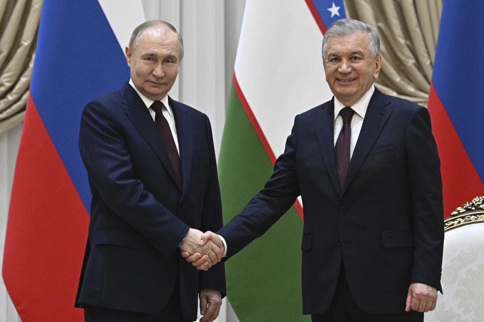 Uzbek President Shavkat Mirziyoyev, right, and Russian President Vladimir Putin pose for a photo prior to their talks at the Kuksaroy Presidential Palace in Tashkent, Uzbekistan, Monday, May 27, 2024. (Sergei Bobylev, Sputnik, Kremlin Pool Photo via AP)