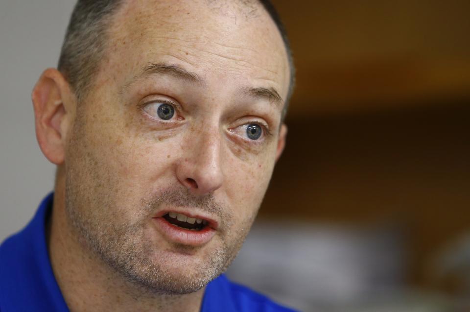 In this May 3, 2018, photo, Travis Brenda, a teacher at Rockcastle County High School, speaks during an interview in Mt. Vernon, Ky. The math teacher was pleased when the state Supreme Court struck down a law that would have made changes to his pension. (AP Photo/Wade Payne)