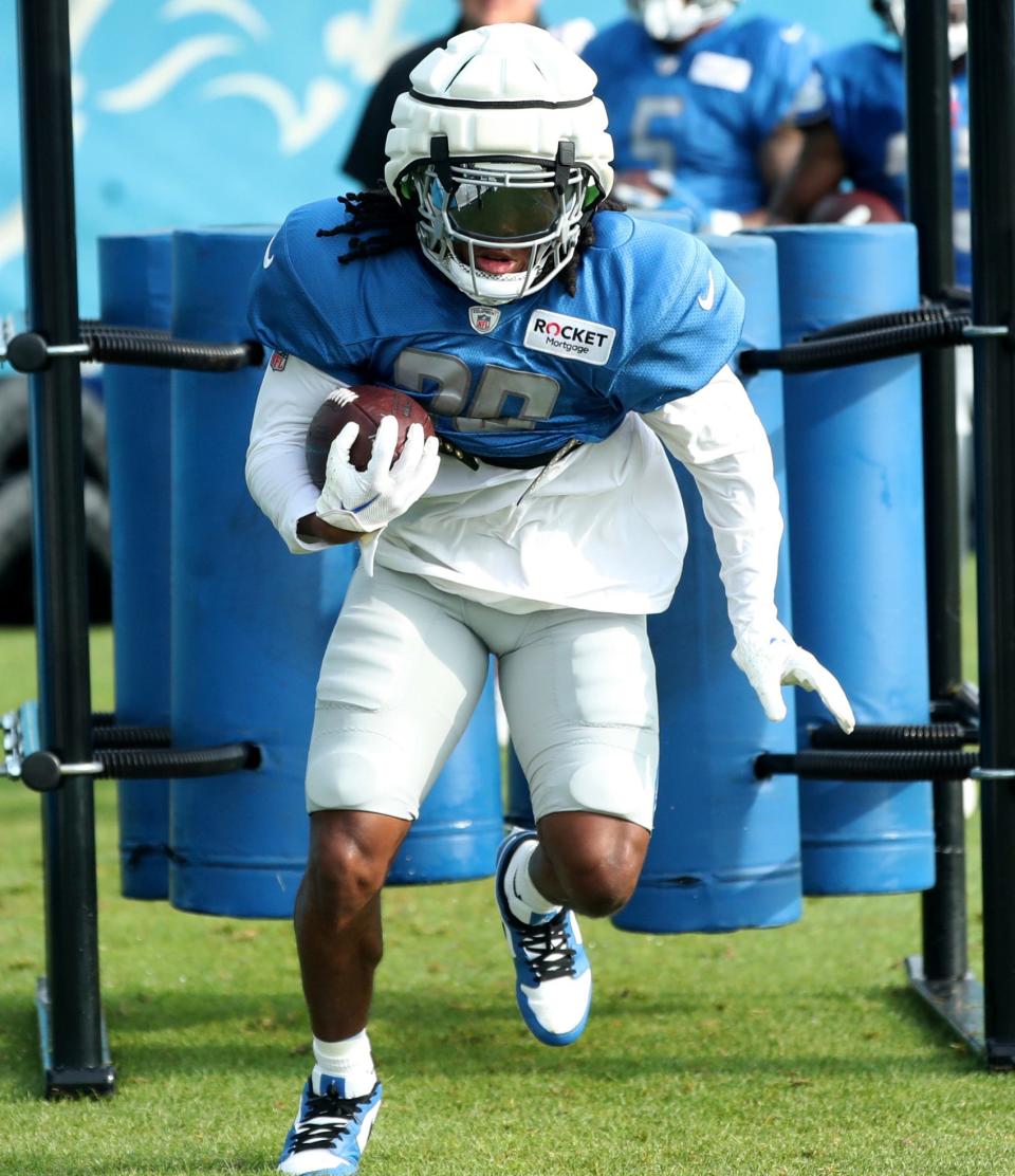 Detroit Lions running back Jahmyr Gibbs (26) goes through drills during training camp at team headquarters in Allen Park on Friday, July 28, 2023.