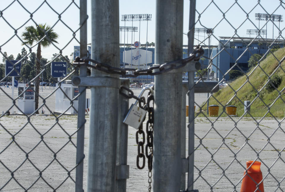 LOS ANGELES, CA-MARCH 26, 2020:  The gates leading to an entrance to Dodger Stadium are locked on what would have been opening day if not for the coronavirus outbreak.   (Photo by Mel Melcon/Los Angeles Times via Getty Images)